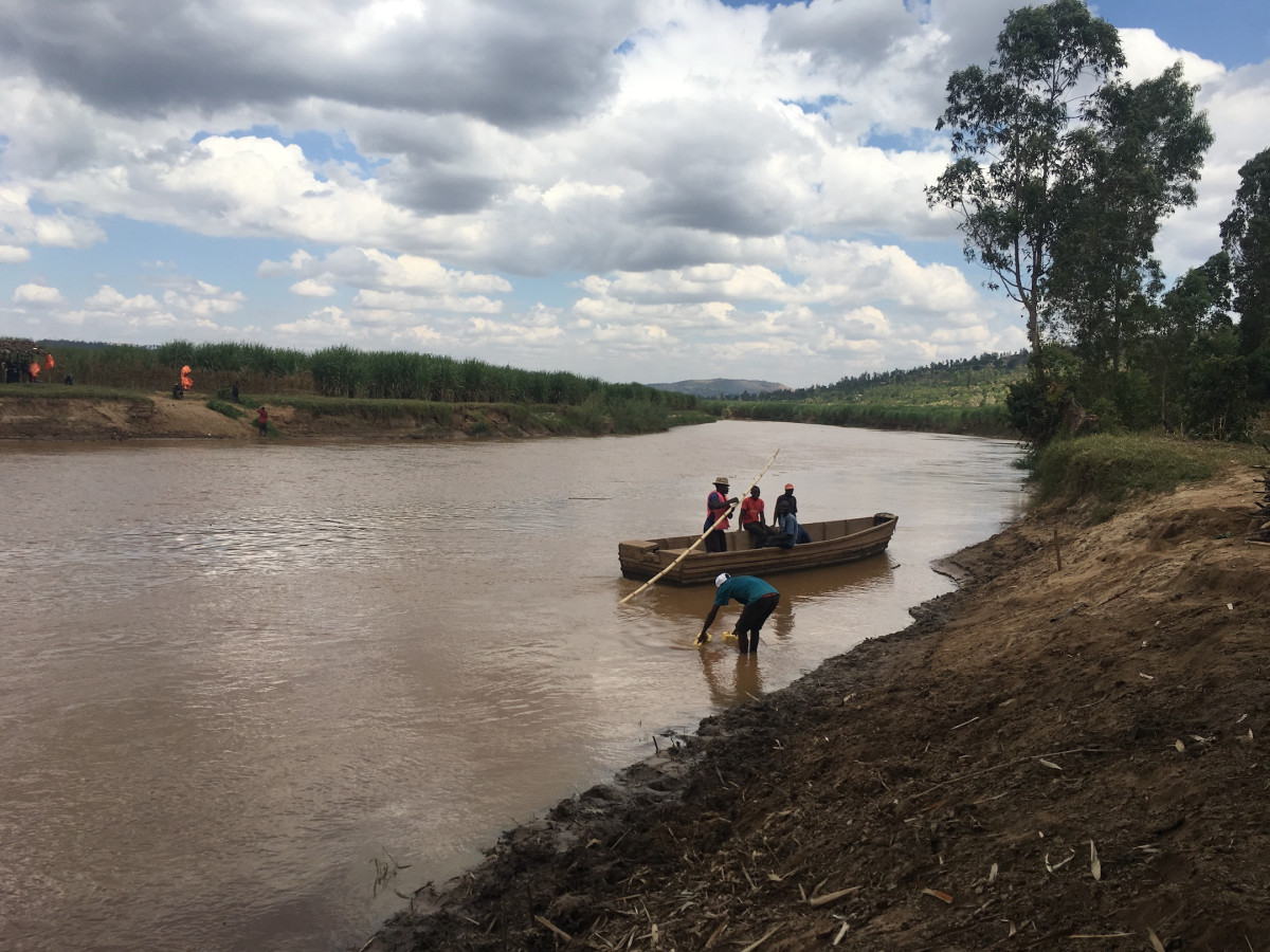 People on a boat in a river in Rwanda
